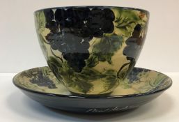 A Paul Jackson grape and vine decorated bowl, signed and dated 1996 to base,