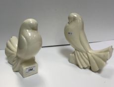 A pair of Jacques Adnet (1901-84) cream glazed pottery figures entitled “Pigeon Tête Penchée” in