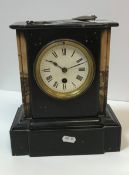 A circa 1900 marble and black slate cased mantle clock,