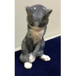 A collection of three Royal Copenhagen cat figures including seated tabby cat (no.