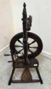 A 19th Century fruit wood spinning wheel of typical form,