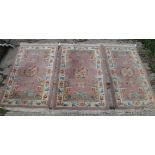 A set of three Chinese rugs,