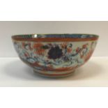 A Chinese polychrome decorated bowl set with flowers and insects, 29.