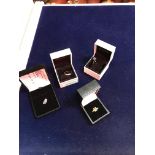 A collection of three 9 carat gold and stone set dress rings,