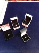 A collection of three 9 carat gold and stone set dress rings,