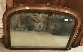 A late Victorian giltwood and gesso framed shallow dome top over mantle mirror within a rope work