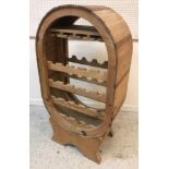 A modern pine barrel type wine rack,
