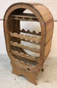 A modern pine barrel type wine rack,