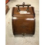 A circa 1900 mahogany and satinwood and cross-banded carved oak coal box in the manner of Dr