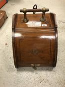 A circa 1900 mahogany and satinwood and cross-banded carved oak coal box in the manner of Dr