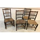 A collection of four ash / walnut spindle back chairs, two with cane seats, two with rush seats,