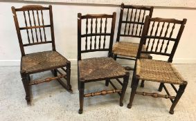 A collection of four ash / walnut spindle back chairs, two with cane seats, two with rush seats,