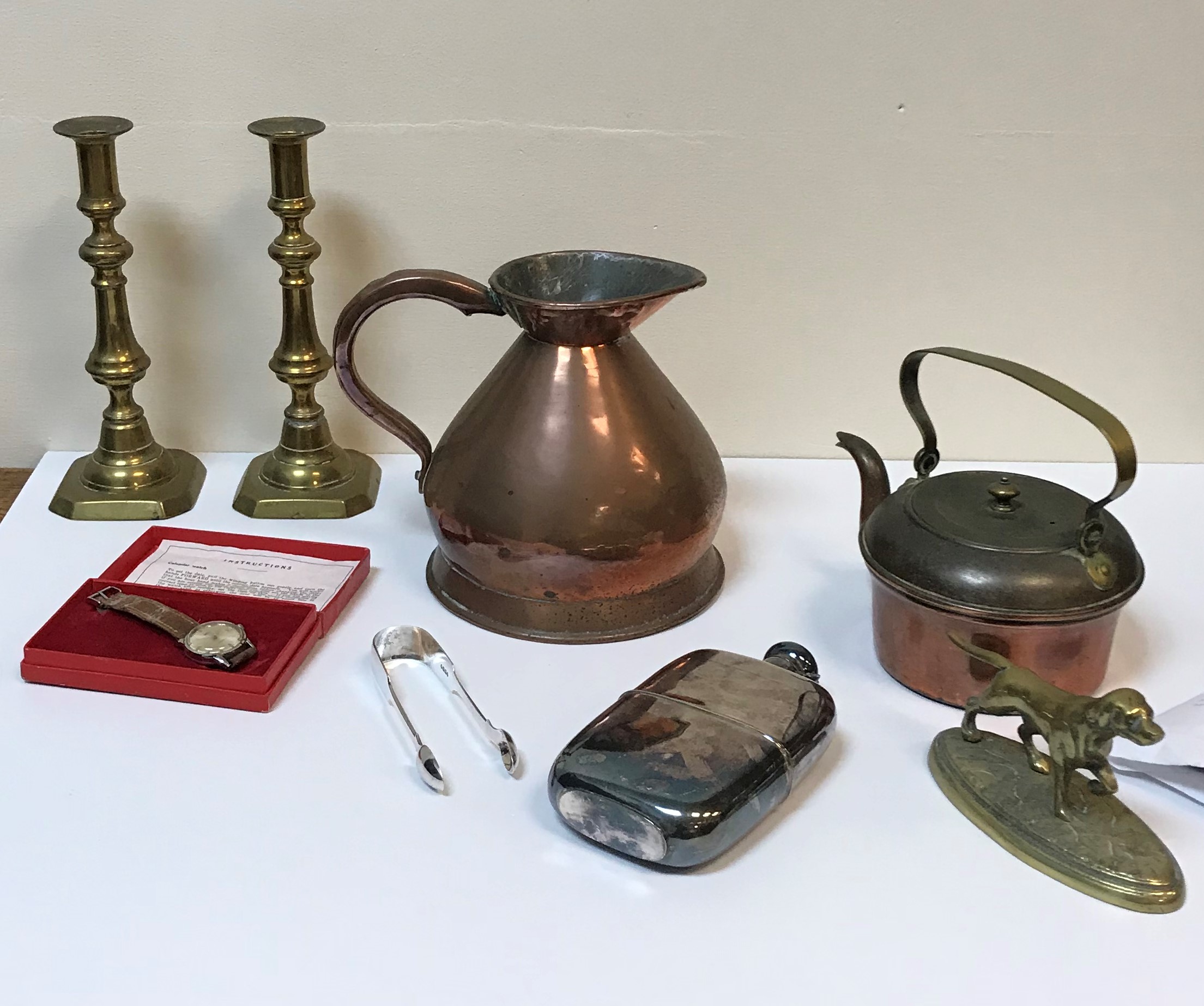 A box of various metal wares, to include plated hip flask, pair of Victorian silver sugar tongs,