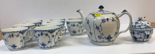 A Royal Copenhagen "Blue Half Lace" pattern tea service comprising twelve teacups and saucers,