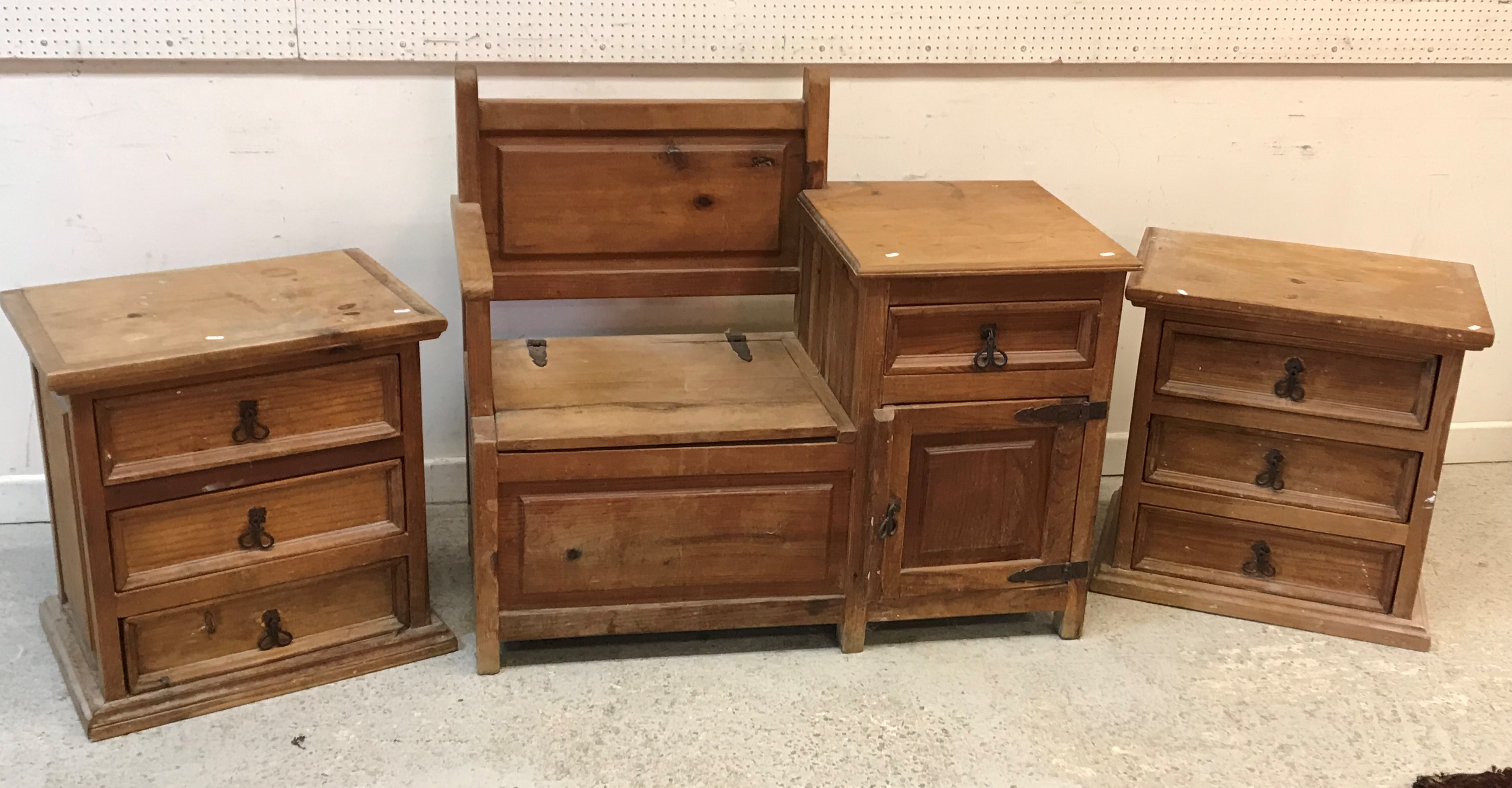 A pair of modern pine three drawer chests with wrought iron handles,