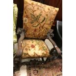 An 18th Century Continental oak framed hall chair or throne chair with long stitch needlework