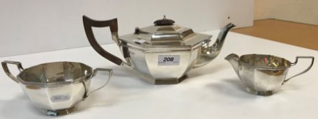 A George V silver Art Deco style three-piece tea set of faceted form (by Walker & Hall,