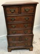 A modern mahogany cabinet as a miniature Georgian chest on chest,