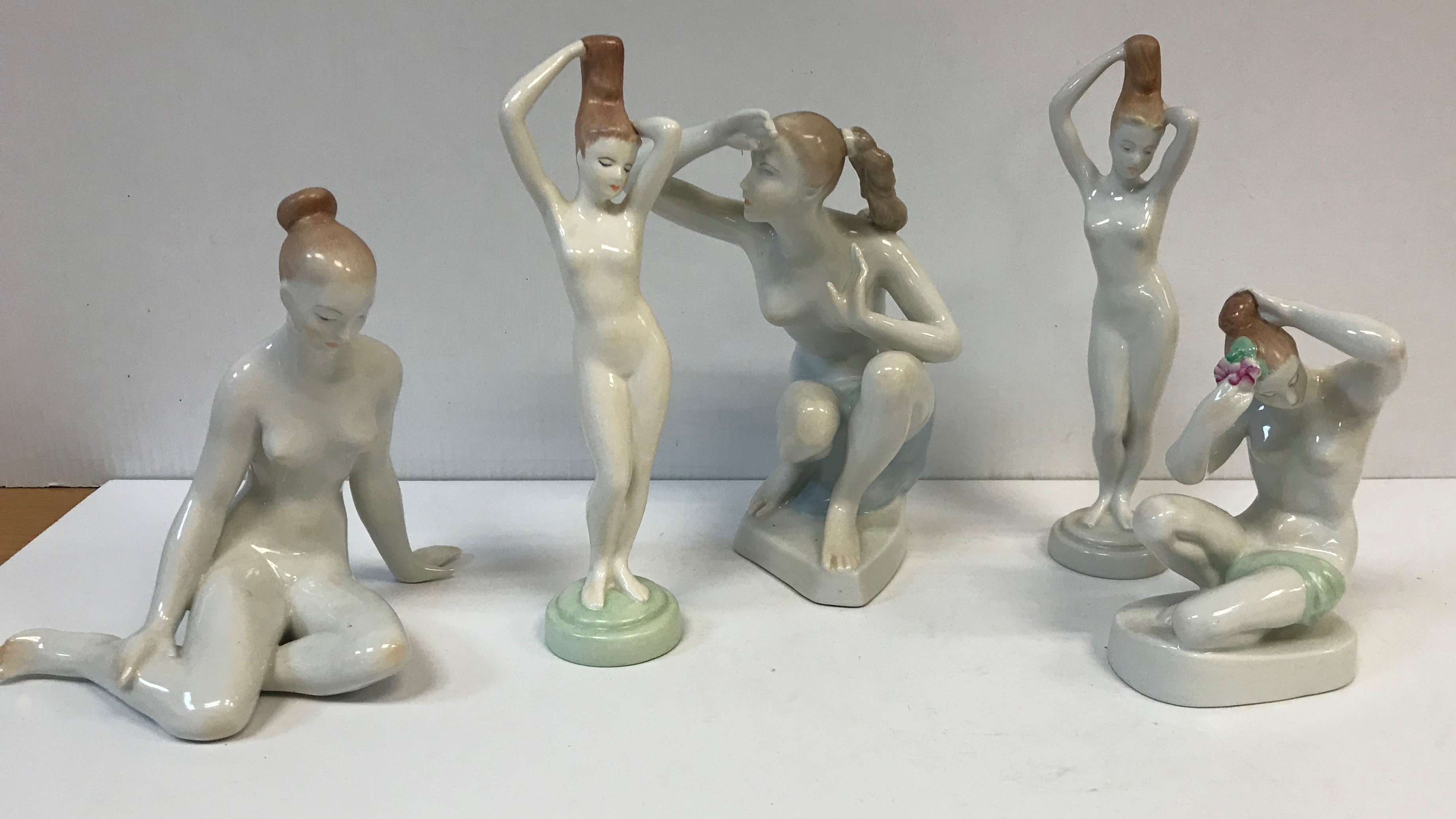 A collection of five Hungarian hand-painted porcelain figures of nudes by Aquincum of Budapest,