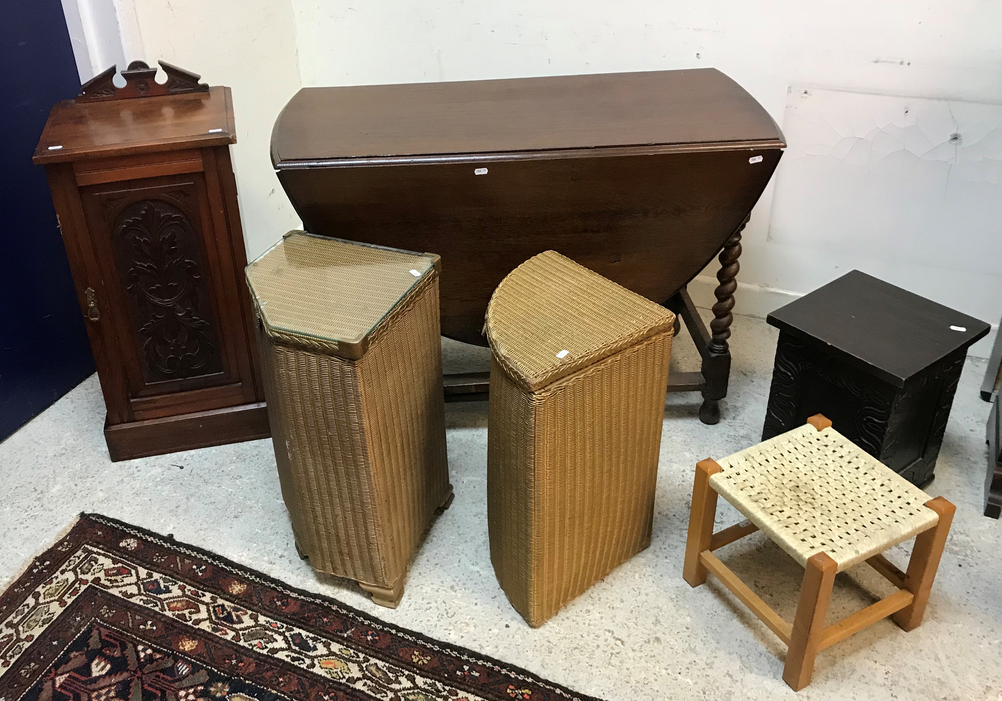 A circa 1900 oak student's bureau with bow-fronted top over a full front enclosing a base with