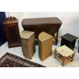 A circa 1900 oak student's bureau with bow-fronted top over a full front enclosing a base with