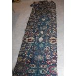 Five various Agra carpet fragments, all floral decorated on a blue ground,