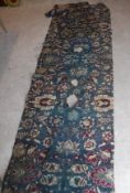 Five various Agra carpet fragments, all floral decorated on a blue ground,