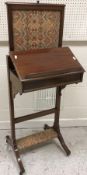 An Edwardian mahogany fireside reading stand with pop-up screen and ratchet bookstand on end pillar