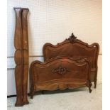 A Louis XV style walnut bedstead with mattress,
