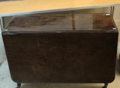 A Victorian mahogany rectangular drop-leaf dining table,