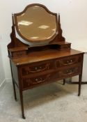 An Edwardian mahogany and inlaid two-piece bedroom suite,