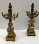 A pair of 19th Century Rococo style gilt brass table lamps, later converted to electricity, 50.