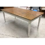 A modern oak and painted farmhouse style kitchen table,