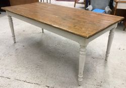 A modern oak and painted farmhouse style kitchen table,
