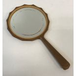 A Cotswold School Arts and Crafts hand mirror with tapered spear shaped handle and multi-faceted