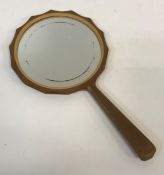 A Cotswold School Arts and Crafts hand mirror with tapered spear shaped handle and multi-faceted