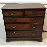 A George III North Country English oak and cross-banded chest,