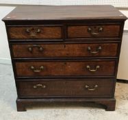 A George III North Country English oak and cross-banded chest,