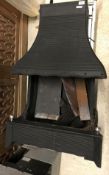 A modern cast iron fire with integral back and hood 101 cm high