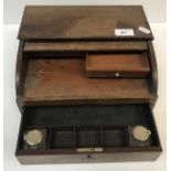 A 19th Century mahogany tambour top travelling writing case with basic fitted drawer containing two