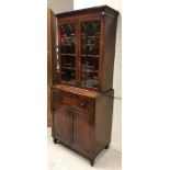 A late Regency mahogany secretaire bookcase of small proportions,