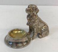 A 20th Century white metal salt as a Retriever sat before a dog bowl, with gilt-washed interior, 7.