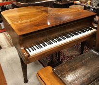 A walnut cased baby grand piano,