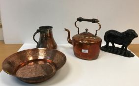 An Egyptian engraved copper bowl with flared rim, 32 cm diameter x 8 cm high,