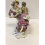 A 19th Century Vienna porcelain figure group of Harlequin and Columbine dancing,