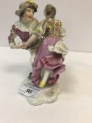 A 19th Century Vienna porcelain figure group of Harlequin and Columbine dancing,