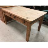 A circa 1900 pine farmhouse kitchen table with scrubbed plank top over two drawers,