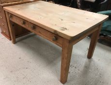 A circa 1900 pine farmhouse kitchen table with scrubbed plank top over two drawers,