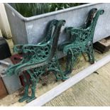 Two pairs of painted cast iron bench ends