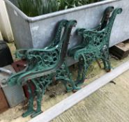 Two pairs of painted cast iron bench ends